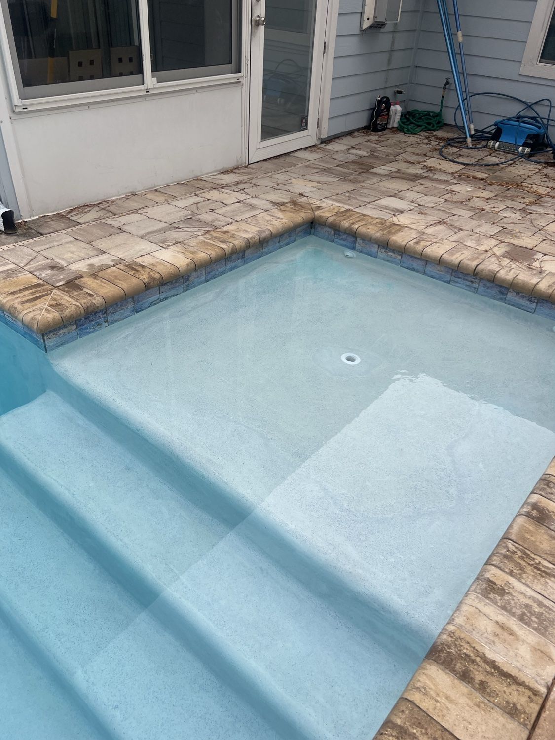 Clear residential saltwater pool served after salt cell cleaning