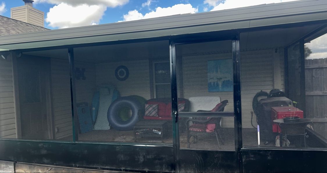 Finished rescreened patio enclosure from a side angle