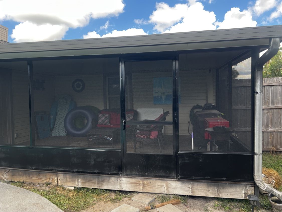 Patio screen enclosure freshly rescreened with new black screens